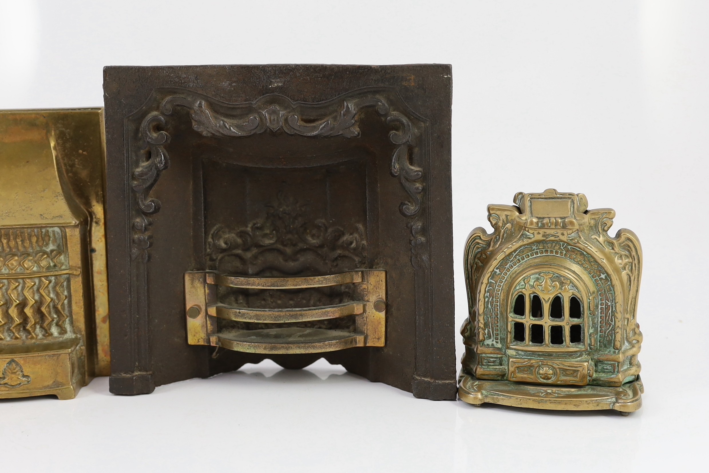 Two Victorian cast iron fire grate models, and two cast brass fire grate models, largest 8in. wide